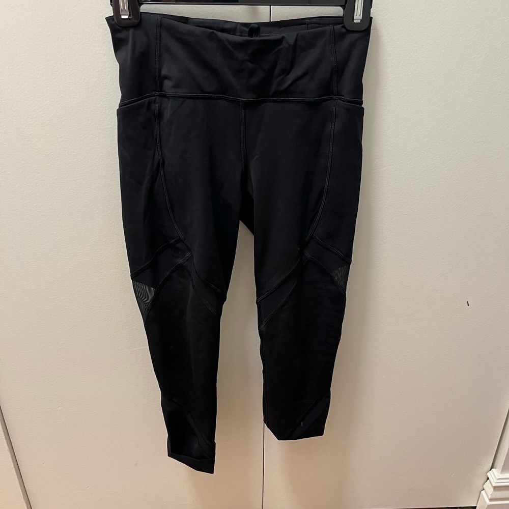Lululemon leggings. Cropped with mesh cut outs. Size 4. Good condition